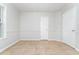 Bedroom with crown molding, tiled floors, and large window for ample natural light at 606 Arden St, Burlington, NC 27215