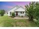 Charming single-story home featuring a cozy front porch, neat landscaping, and inviting curb appeal at 606 Arden St, Burlington, NC 27215