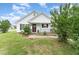 Lovely single-story house boasting a quaint porch, well-maintained garden, and appealing exterior at 606 Arden St, Burlington, NC 27215