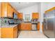 Kitchen highlighting stainless appliances, granite countertops, and tiled backsplash for style and functionality at 606 Arden St, Burlington, NC 27215
