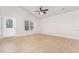 Bright, airy living area featuring tile floors, vaulted ceilings, and ample natural light from a large window at 606 Arden St, Burlington, NC 27215