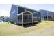 Rear exterior with covered patio, large backyard perfect for relaxing or entertaining guests at 609 Ramsours Mill Dr, Holly Springs, NC 27540