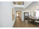 Spacious dining room with hardwood floors, elegant lighting, and decorative moldings at 609 Ramsours Mill Dr, Holly Springs, NC 27540