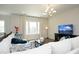Bright living room featuring contemporary décor, hardwood floors, and ample natural light at 609 Ramsours Mill Dr, Holly Springs, NC 27540