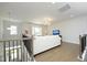 Cozy living room with hardwood floors, comfortable seating, and large windows overlooking the front door at 609 Ramsours Mill Dr, Holly Springs, NC 27540