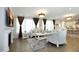 Luxurious living room with ornate furniture, decorative lighting, and large windows at 609 Ramsours Mill Dr, Holly Springs, NC 27540