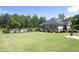 Community pool house with pool view and lush landscaping at 609 Ramsours Mill Dr, Holly Springs, NC 27540
