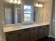Bright bathroom with dual sinks, modern mirrors, and stylish vanity with lots of storage space at 61 Black Walnut Dr # 188, Garner, NC 27529