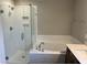Elegant bathroom with a large, glass-enclosed shower and separate tub with tile surround at 61 Black Walnut Dr # 188, Garner, NC 27529