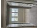 Bright bedroom with neutral walls, and three windows offering natural light, with a carpet floor at 61 Black Walnut Dr # 188, Garner, NC 27529