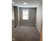 Bedroom with neutral gray walls and carpeting at 701 Linwood Ave Ave, Durham, NC 27701