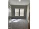 Cozy bedroom featuring neutral gray walls and carpeting at 701 Linwood Ave Ave, Durham, NC 27701