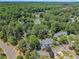 Aerial view of homes nestled in mature trees and green landscape at 7601 Wellesley N Park, Raleigh, NC 27615