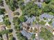 An aerial view of a neighborhood featuring mature trees and well-maintained landscaping at 7601 Wellesley N Park, Raleigh, NC 27615