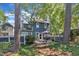 Charming backyard with a patio, adorned with lush greenery and mature trees at 7601 Wellesley N Park, Raleigh, NC 27615