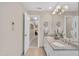 Bathroom featuring double sinks, granite countertop, and ample lighting at 7601 Wellesley N Park, Raleigh, NC 27615