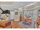 Bright dining room with hardwood floors, a rug, and windows with lots of natural light at 7601 Wellesley N Park, Raleigh, NC 27615