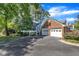 Inviting home with a two-car garage, well-kept lawn, and meticulously landscaped garden at 7601 Wellesley N Park, Raleigh, NC 27615