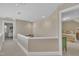 Hallway features neutral wall color, carpet flooring, and view of bedrooms at 7601 Wellesley N Park, Raleigh, NC 27615