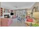 Cozy living room features a fireplace, built-in shelves, and access to an outdoor area at 7601 Wellesley N Park, Raleigh, NC 27615