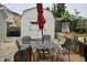 A backyard patio with table and chairs and two storage sheds surrounded by privacy fence at 764 Grove Creek Ln, Raleigh, NC 27610