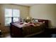 Bright bedroom with a comfortable bed and a window with natural light, creating a relaxing atmosphere at 764 Grove Creek Ln, Raleigh, NC 27610