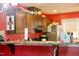 This kitchen features wooden cabinets, stainless steel appliances, and a breakfast bar at 764 Grove Creek Ln, Raleigh, NC 27610