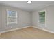 Bright, airy bedroom with neutral walls, and natural light from the windows at 780 Indian Trail Village, Burlington, NC 27217