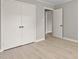 Bedroom with plank flooring, a closet, and access to the ensuite bath at 780 Indian Trail Village, Burlington, NC 27217