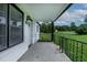 A covered front porch features an ornate railing and ample space overlooking the front yard at 780 Indian Trail Village, Burlington, NC 27217
