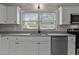 Close up of modern kitchen with stainless steel appliances and granite countertops at 780 Indian Trail Village, Burlington, NC 27217