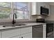Bright kitchen with granite countertops, stainless steel appliances, and modern fixtures at 780 Indian Trail Village, Burlington, NC 27217