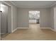 Open living room showcasing new floors, neutral paint, and open view to the updated kitchen at 780 Indian Trail Village, Burlington, NC 27217