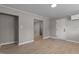 Open living room with a view to a hallway and a white door at 780 Indian Trail Village, Burlington, NC 27217