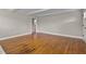 Open-concept living room with hardwood floors, neutral paint, and ample natural light at 780 Indian Trail Village, Burlington, NC 27217