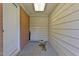Outdoor storage area attached to the home with brick and wood siding at 780 Indian Trail Village, Burlington, NC 27217