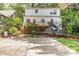 The backyard has a trampoline and a large concrete area with a two-story home in the background at 821 Onslow St, Durham, NC 27705