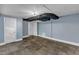 Unfinished basement with tile floors, open space, and a door to a closet area, great for storage or finishing at 821 Onslow St, Durham, NC 27705