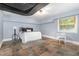 A basement bedroom featuring neutral decor, an area rug and natural light at 821 Onslow St, Durham, NC 27705