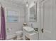 Charming bathroom features a modern sink, toilet, and a window providing natural light at 821 Onslow St, Durham, NC 27705