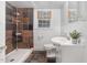 A clean bathroom has a tiled shower and a modern vanity with a sink and toilet at 821 Onslow St, Durham, NC 27705