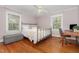 Comfortable bedroom features hardwood floors, neutral decor, and plenty of natural light at 821 Onslow St, Durham, NC 27705