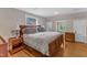 A well-lit primary bedroom featuring hardwood floors, and natural light from two windows at 821 Onslow St, Durham, NC 27705