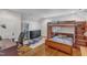 Cozy bedroom with hardwood floors, a bunk bed, and a stylish black dresser at 821 Onslow St, Durham, NC 27705