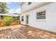 Spacious wooden deck offering an ideal outdoor living space with white brick exterior at 821 Onslow St, Durham, NC 27705