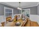 Well-lit dining room showcasing a wooden table, seating for six, and modern lighting at 821 Onslow St, Durham, NC 27705