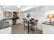 Dining room with a round table, seating for four, and a view to the kitchen at 821 Onslow St, Durham, NC 27705