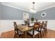 Traditional dining room with wood table, chairs, and wainscoting at 821 Onslow St, Durham, NC 27705