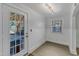 Entryway featuring a glass door to an outdoor deck and a large window at 821 Onslow St, Durham, NC 27705