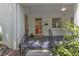 Inviting front porch with black railings and a decorative front door at 821 Onslow St, Durham, NC 27705